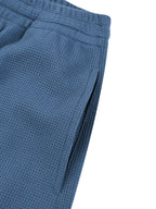 Joggingbroek met wafelpatroon en wijd uitlopende pijpen